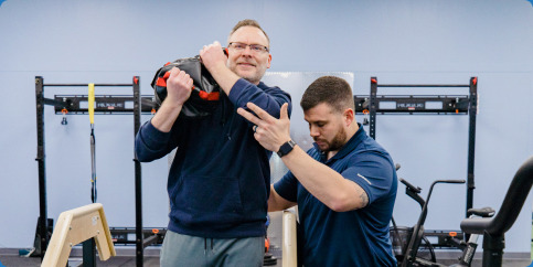 Physical therapist assisting a patient