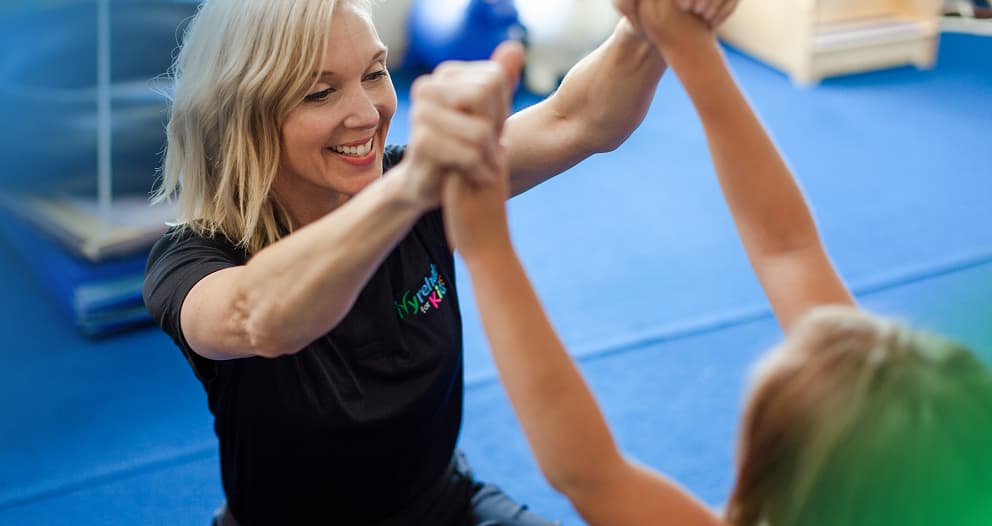 An Ivy Rehab therapist working with a patient
